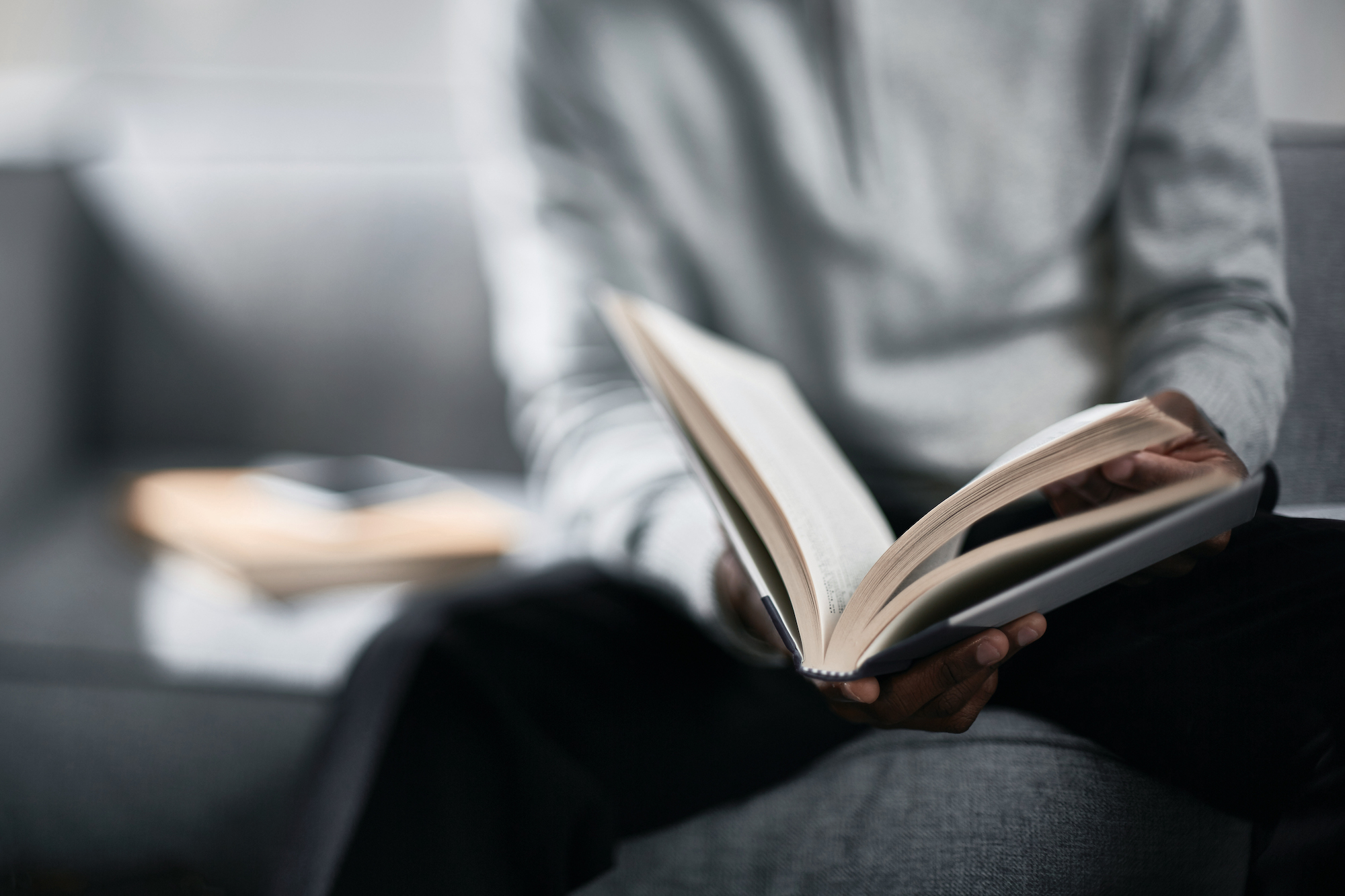 Photo of a man reading a book